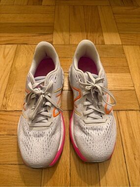 New Balance Light Purple Running Shoes with Pink and Orange Accents